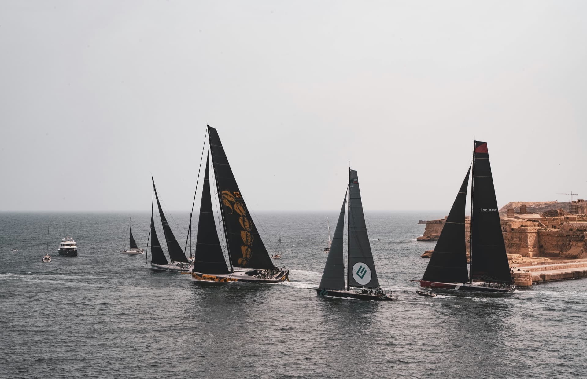 Maxi yacht fleet departing Malta for offshore race