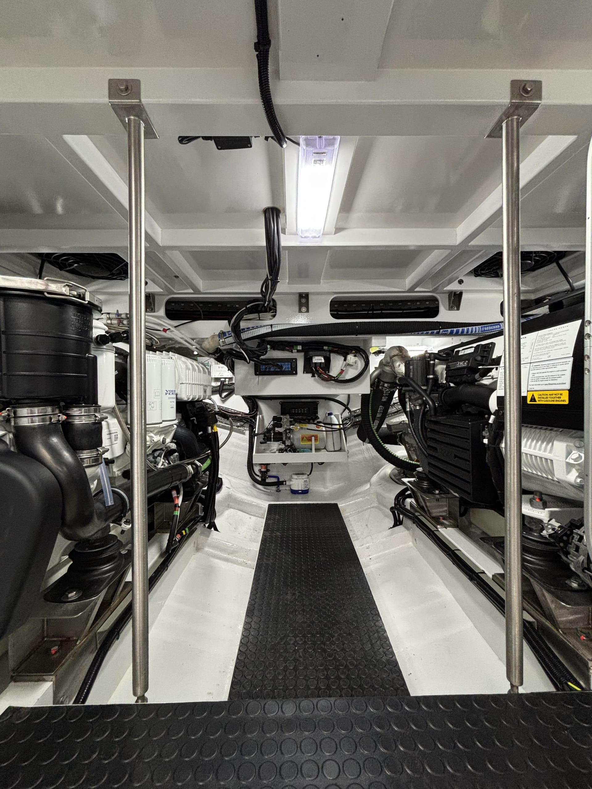 Engine room of the Spirit P50 with walkway between twin Volvo Penta D6 engines