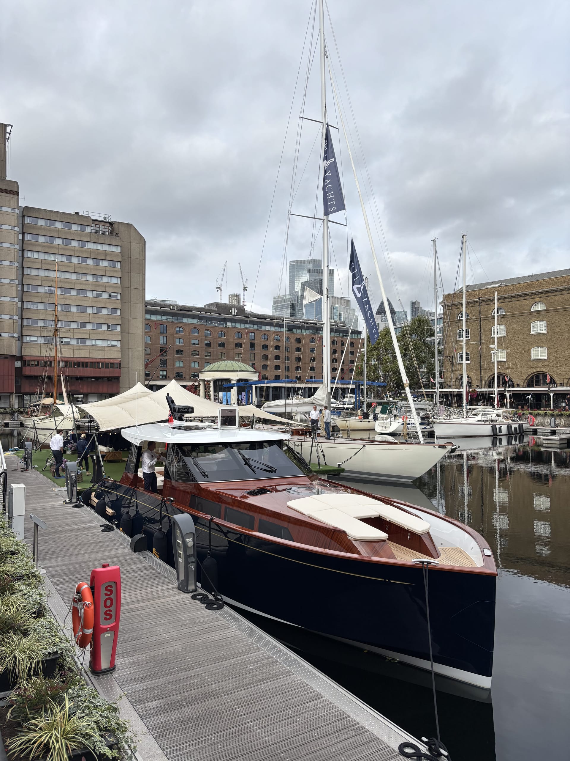 Spirit P50 Coupé Selkie alongside the pontoon at St Katharine Docks, with the Spirit C72 Gwenhyfar II beyond
